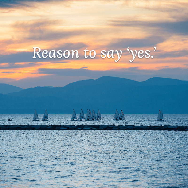 Sailboats on the lake with words "Reason to say 'yes.'"