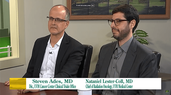 Two men being interviewed on UVM's Across the Fence TV program