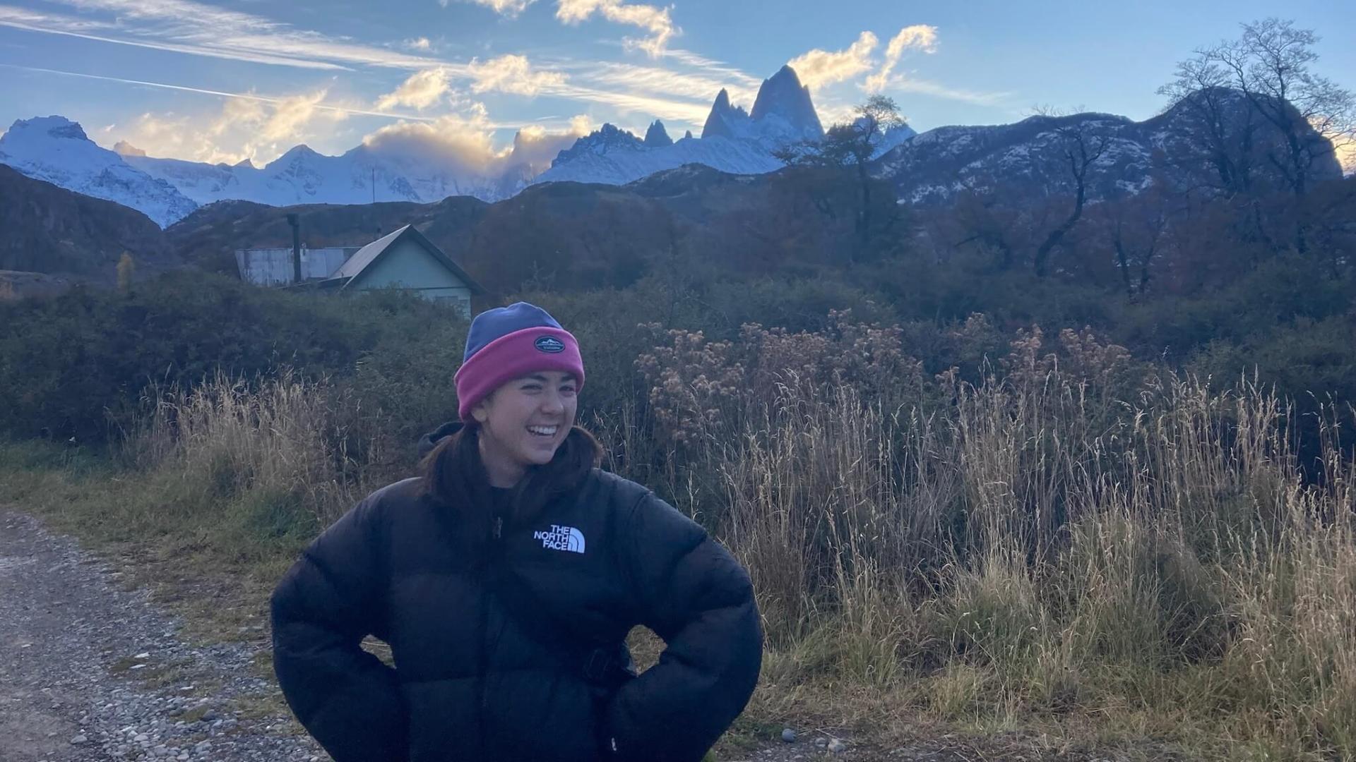 Dexter standing in front of mountains.