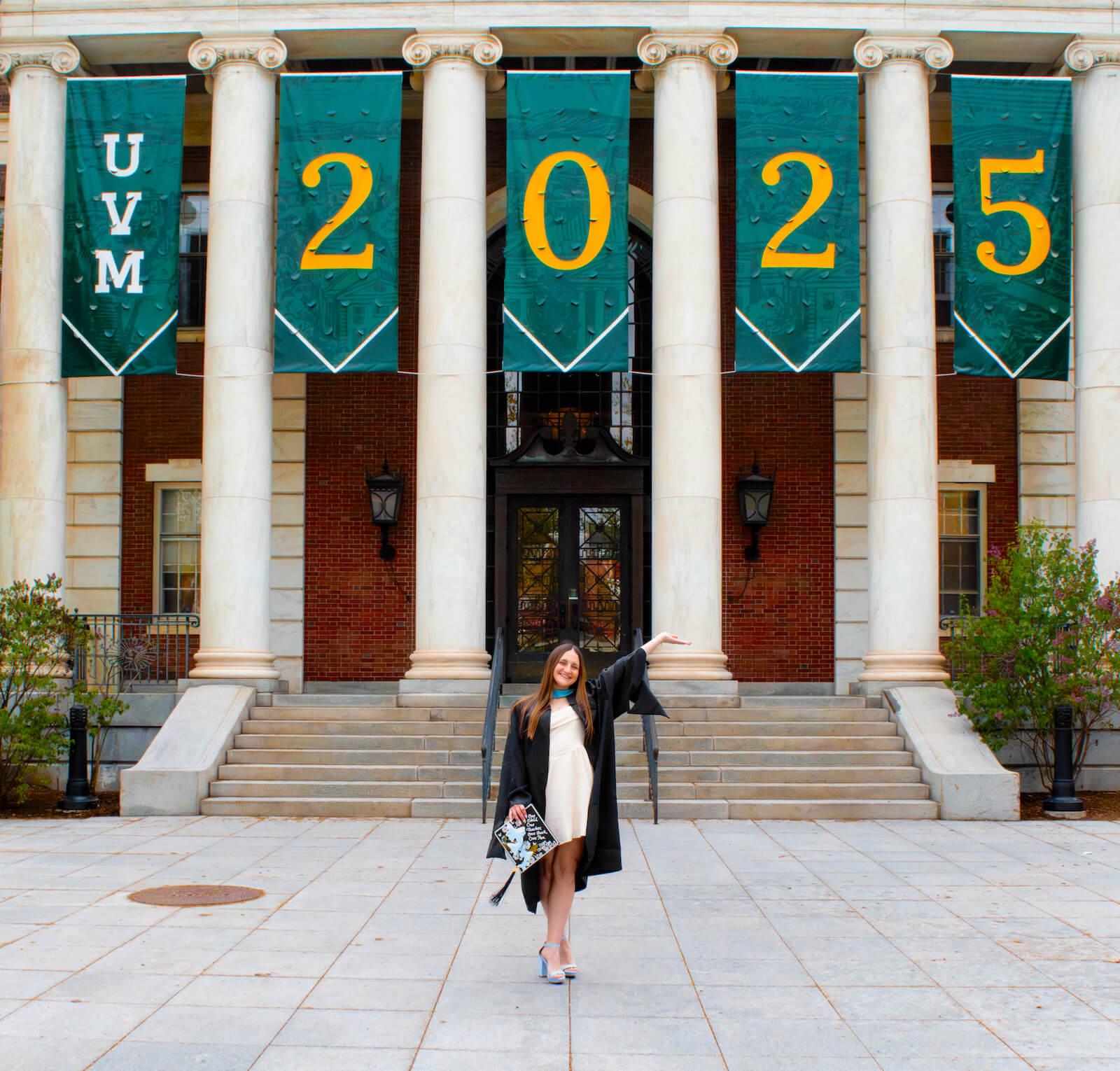 Maggie Sorrentino in front of the UVM Class of 2025 banner in front of Waterman Building.