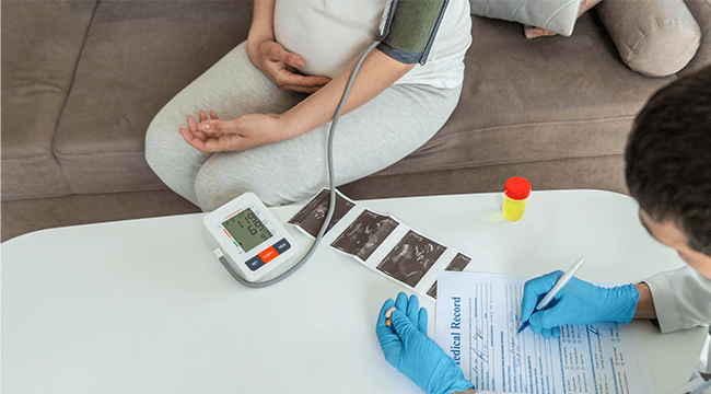 a pregnant person being evaluated by a doctor