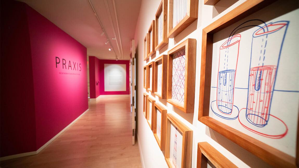 Colorful hallway with exhibits lining opposite side