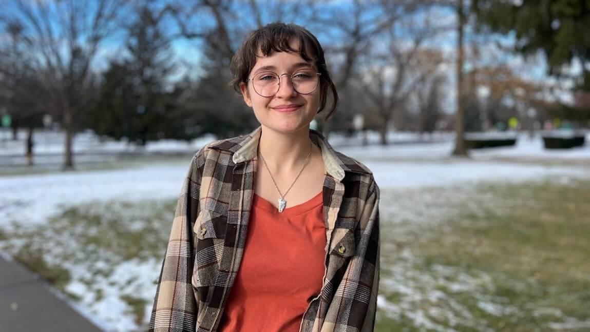 Community and International Development major Miranda Degreenia is standing on UVM campus in winter time.