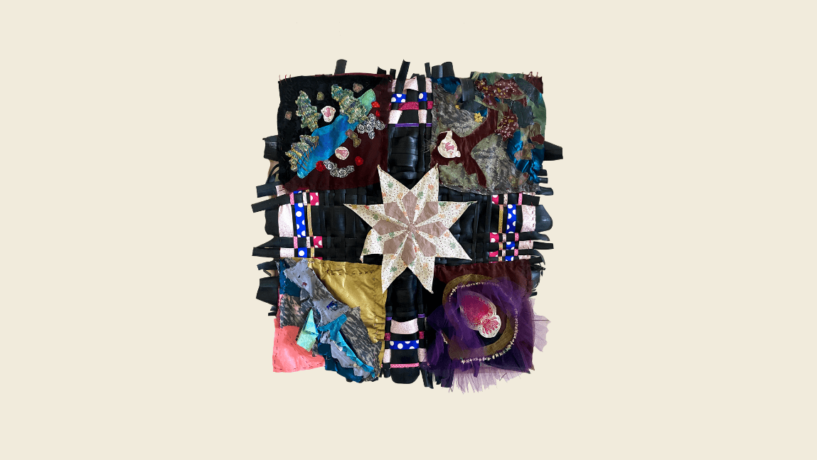 Various fabrics, tubing, and ribbon have been quilted together in a square shape with a star at its center.