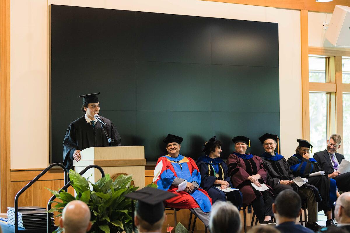 Class speaker Joseph Webber addresses the Sustainable Innovation MBA class of '23 at their inauguration ceremony on August 5, 2023.