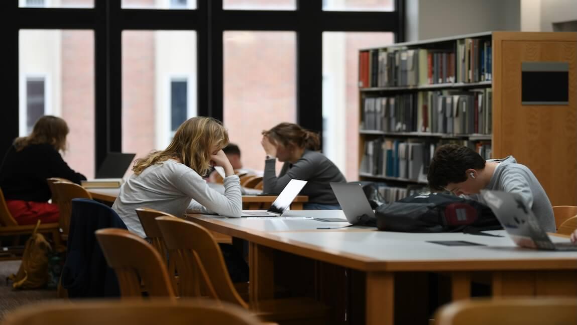 Students studying at a table in Silver Special Collections Library.