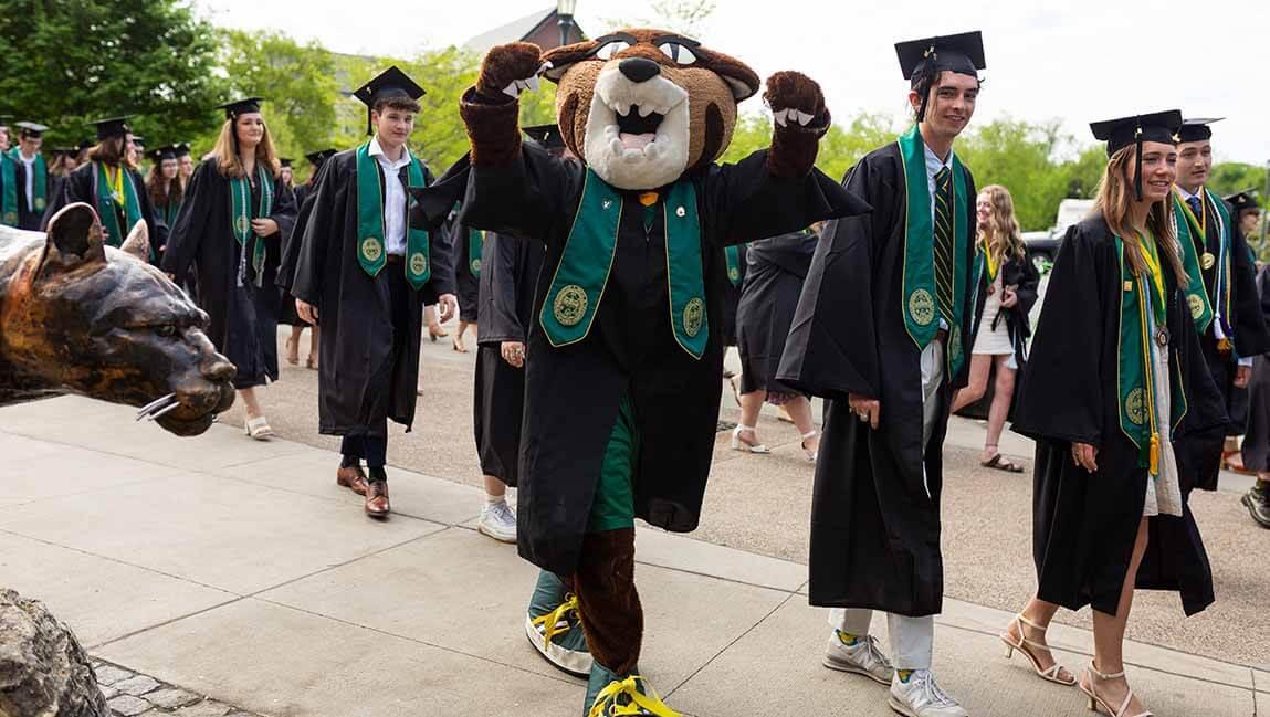 students at commencement with rally cat