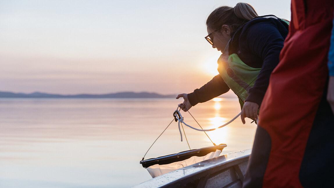 Researcher pulling up a net