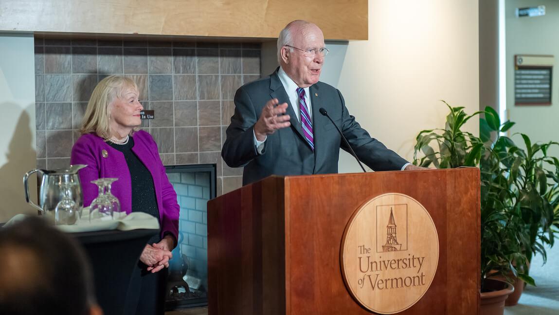 Senator Patrick Leahy speaking at a UVM event with his wife, Marcelle.