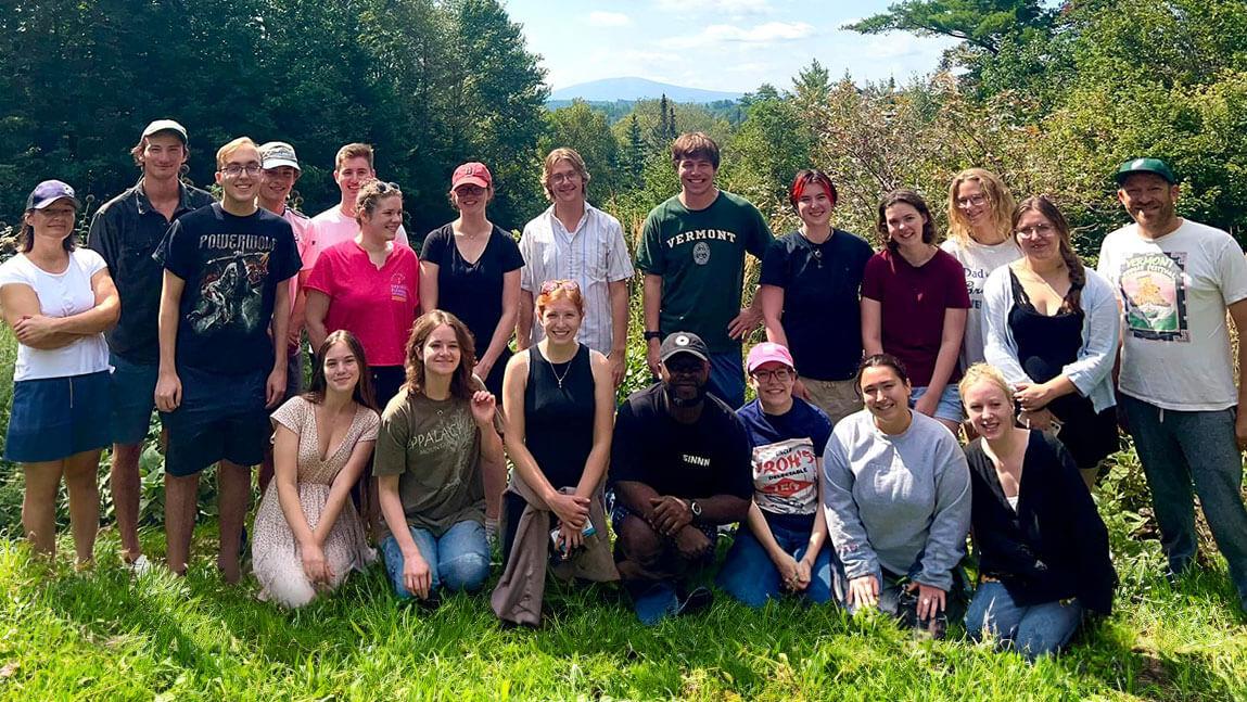 Debate team group photo outdoors on a sunny day