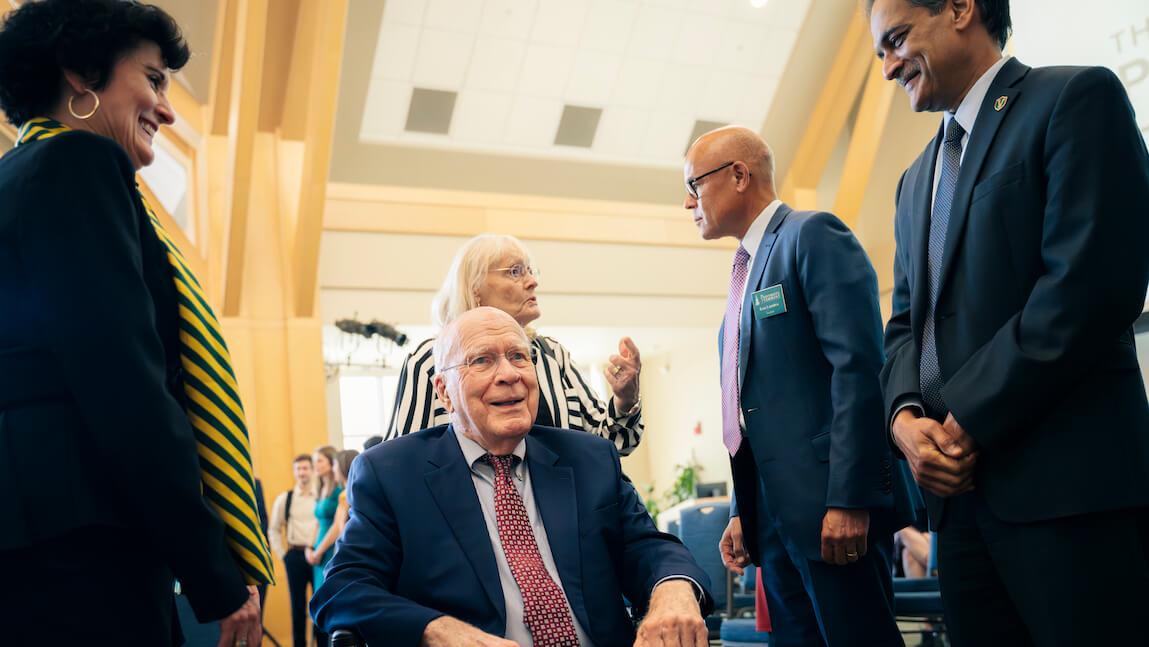 People gathered around former Senator Patrick Leahy