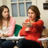 Two student having conversation in classroom